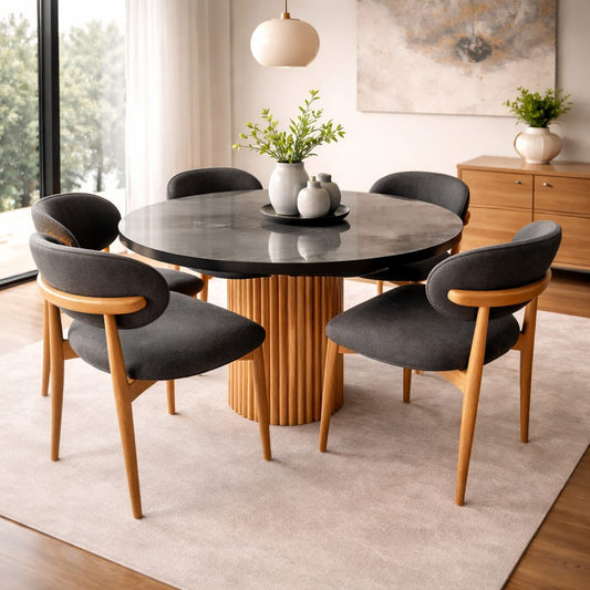 Comedor Riviera redondo con base acanalada, tablero de 1 metro y sillas copeta tapizadas.